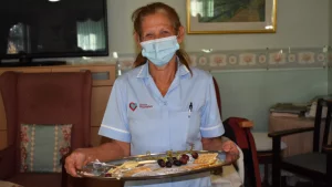 Staff at Footherley Hall with a tray of cheese