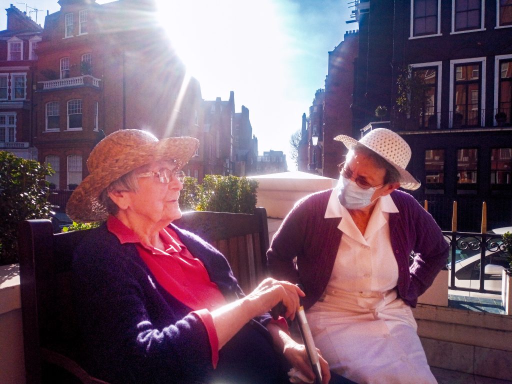 Sister Lourdes with a resident at St Teresa's care home