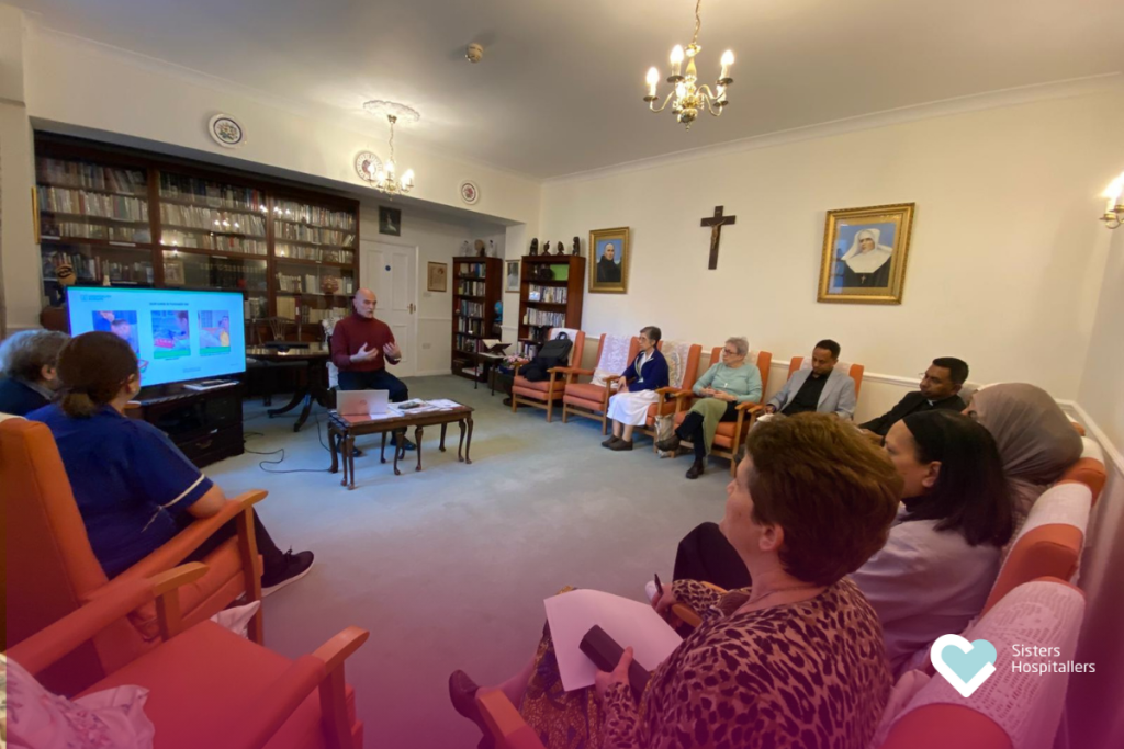 Joan Uribe with the London team at the Sisters Hospitallers centre