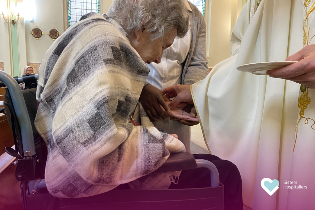 Anointing of a resident’s hands during World Day of the Sick London 2026 Mass.