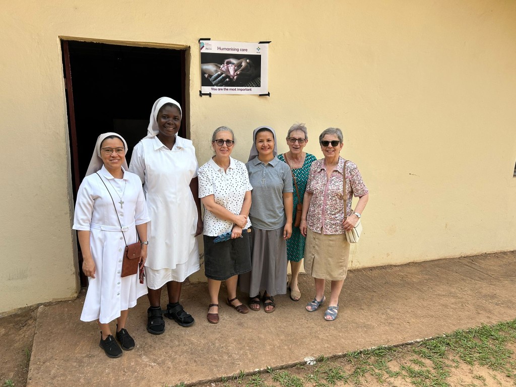 Sisters Hospitallers during the Canonical Visit to Monrovia, standing outside one of the healthcare units in Liberia.
