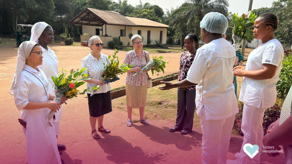 Sisters Hospitallers receiving a welcome from staff during the Canonical Visit to St Benedict Menni Health Centre in Monrovia, Liberia.