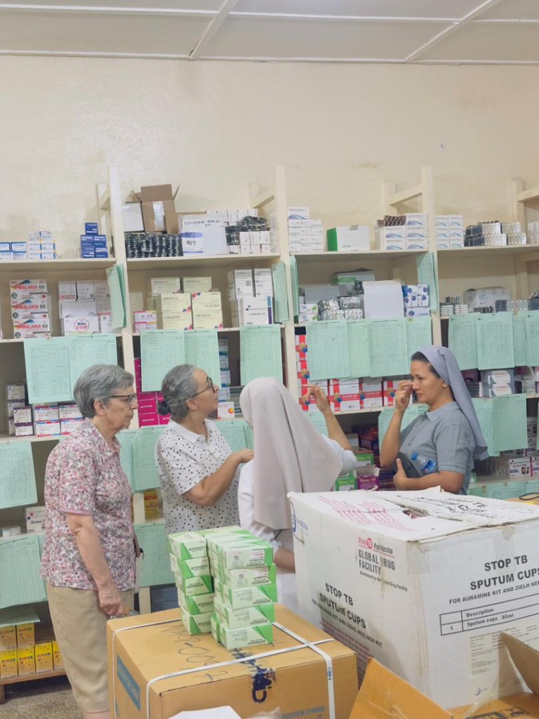 Sisters reviewing medicines and pharmacy supplies at St Benedict Menni Health Centre in Liberia.