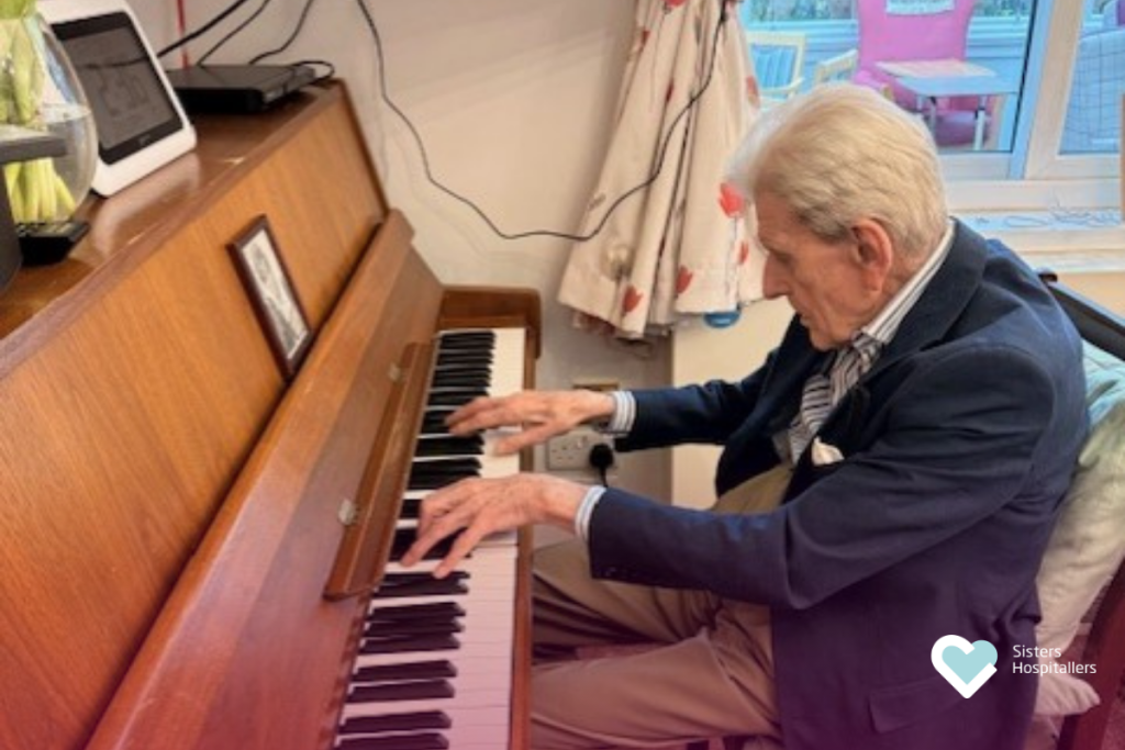 Resident playing piano during meaningful activities at St Teresa’s Home