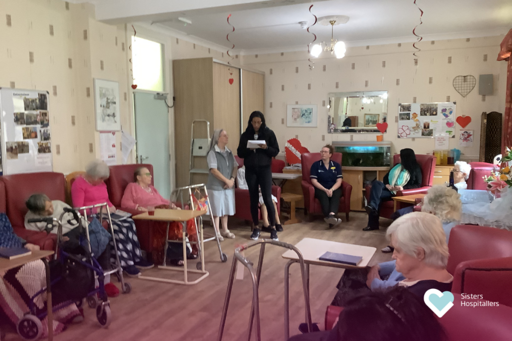 Collaborators reading during World Day of the Sick celebration at St Augustine’s