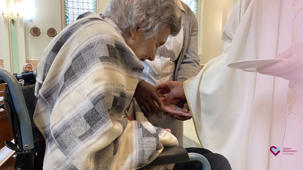 Anointing of a resident’s hands during World Day of the Sick London 2026 at St Teresa’s Chapel.