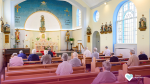 Sisters Hospitallers and members of the community gathered in prayer in the chapel on Constitutions Day