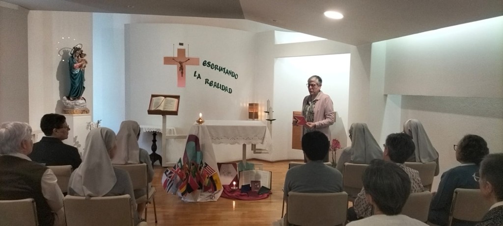 Sr Begoña gathered in prayer at the altar during the 118th Anniversary of the Constitutions in Portugal