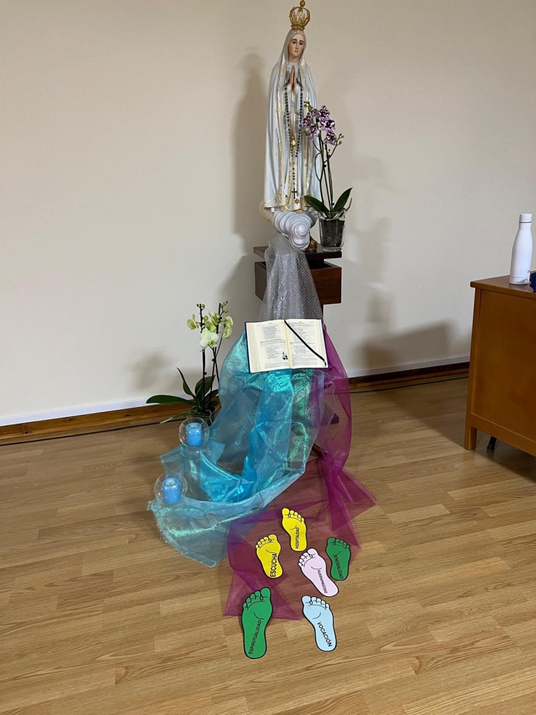 Prayer space with the Virgin Mary, an open book and symbolic footsteps at the 28th Plenary Council in Idanha, Portugal