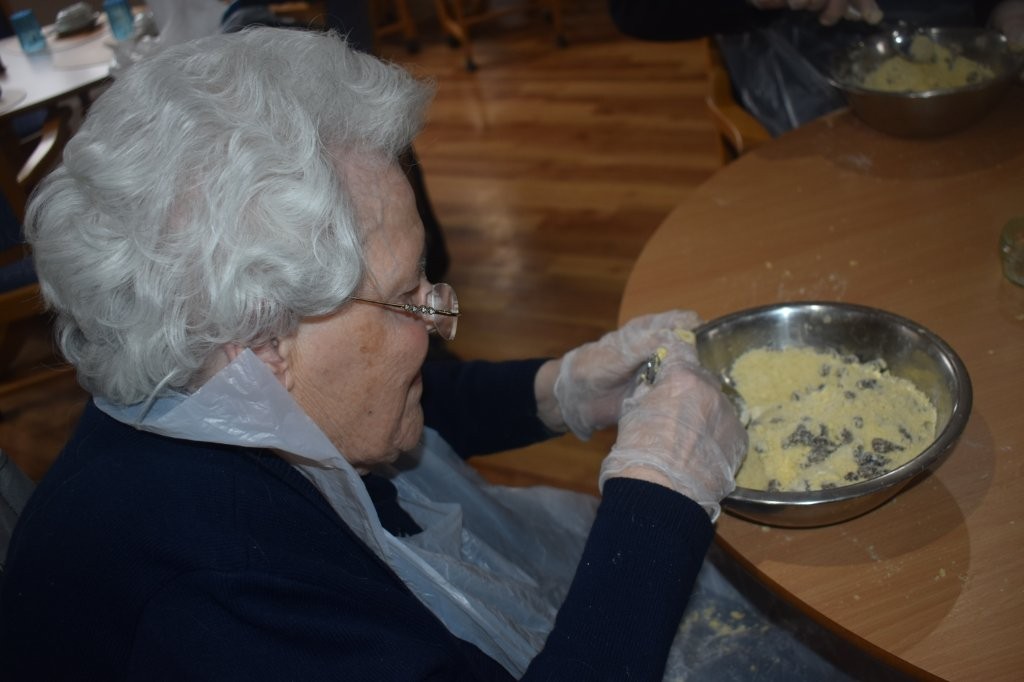 Resident preparing rock cakes during a baking activity at Footherley Hall