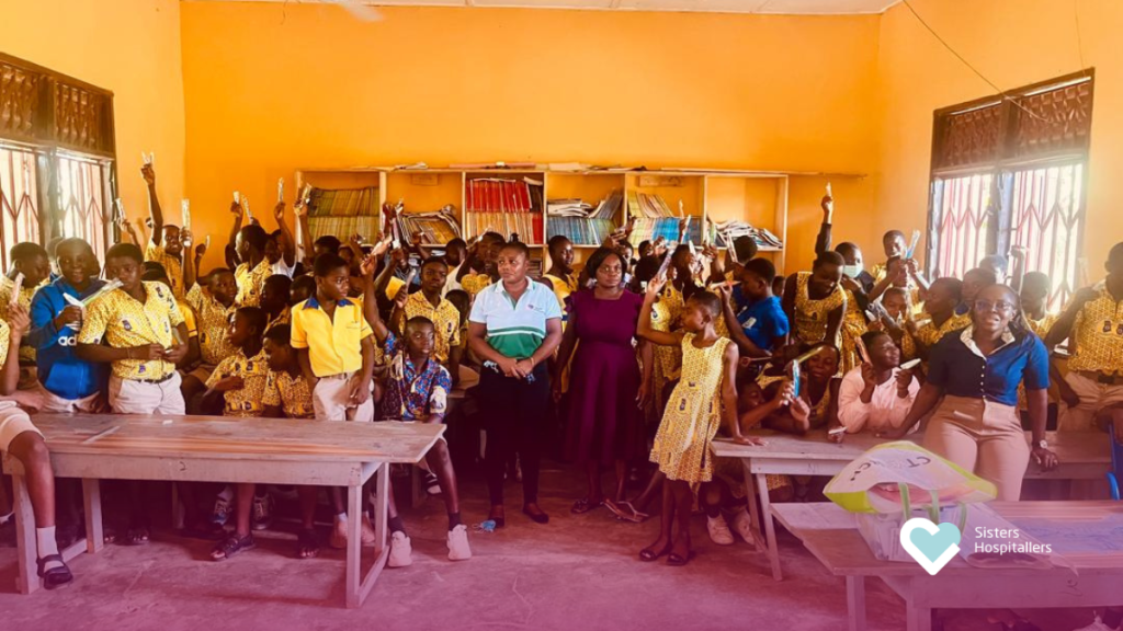 Students at Foso Methodist B School receiving oral health education and toothbrushes during World Oral Health Day outreach in Foso Ghana