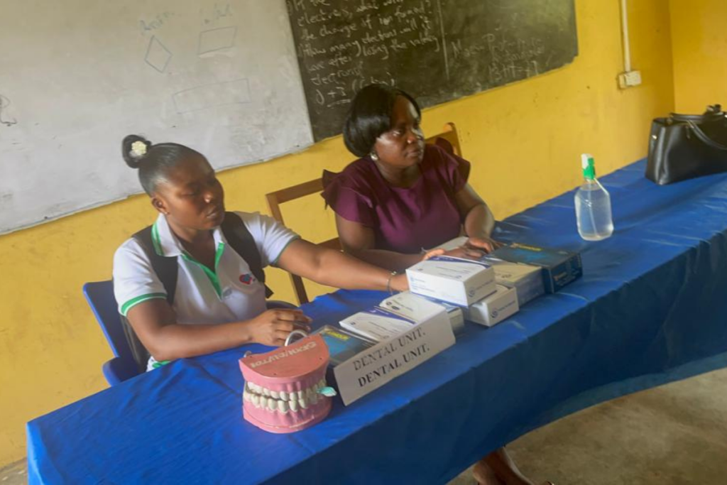Dental team preparing oral health education materials during World Oral Health Day outreach in Foso Ghana